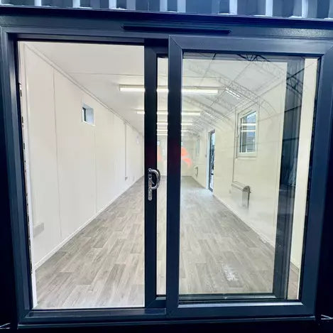 CONTENEDOR DE OFICINA 9,7 X 3 M CON PUERTA CORREDIZA